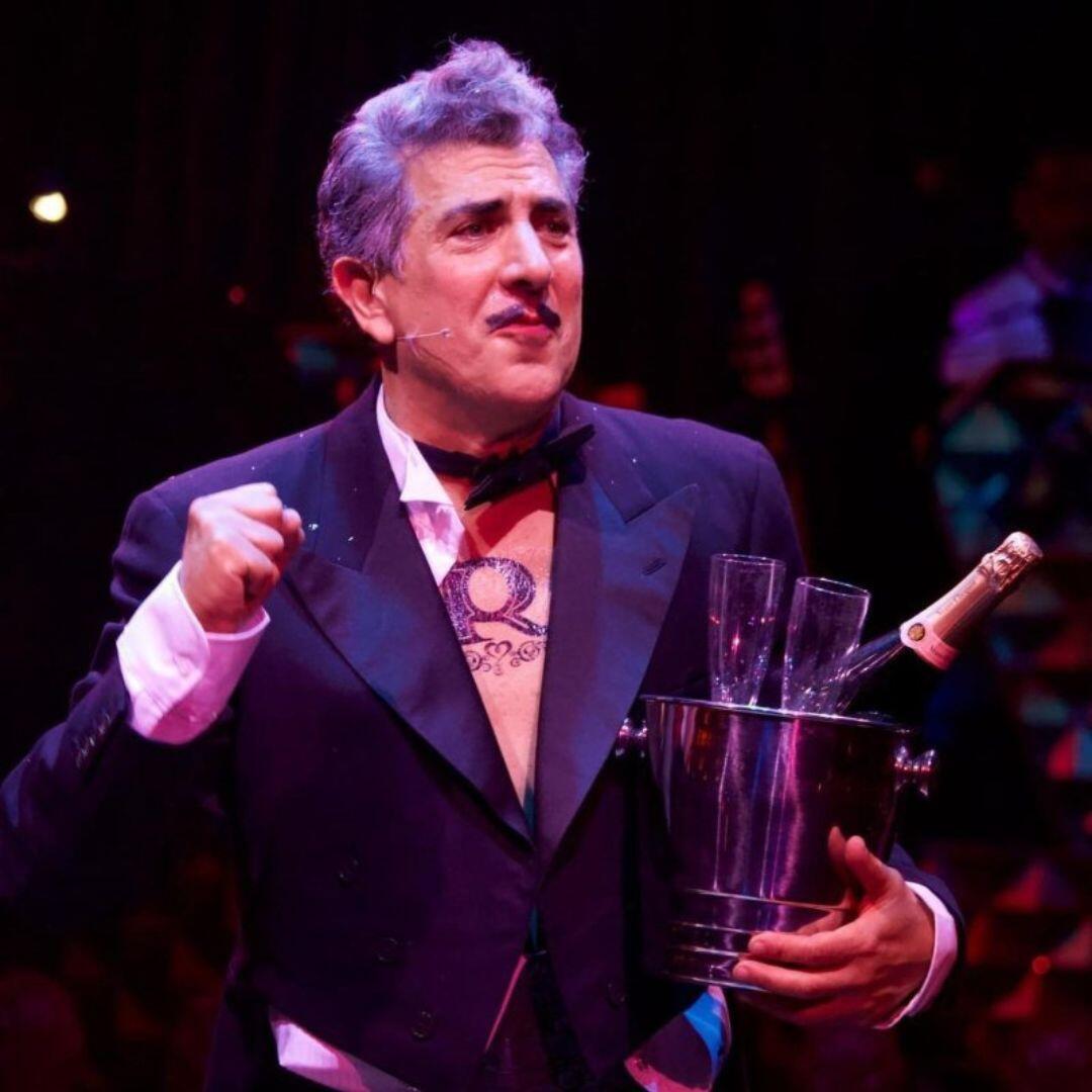 Frank Ferrante performing on stage in Groucho costume