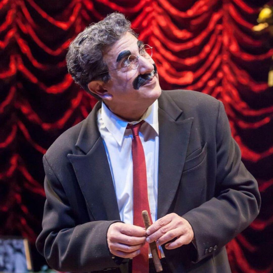 Frank Ferrante performing in a musical scene