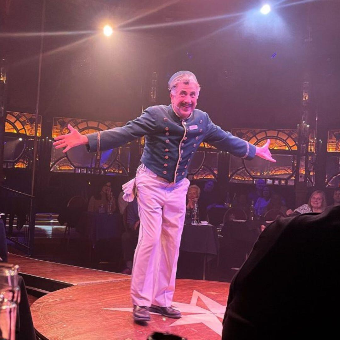 Frank Ferrante with props and a spotlight