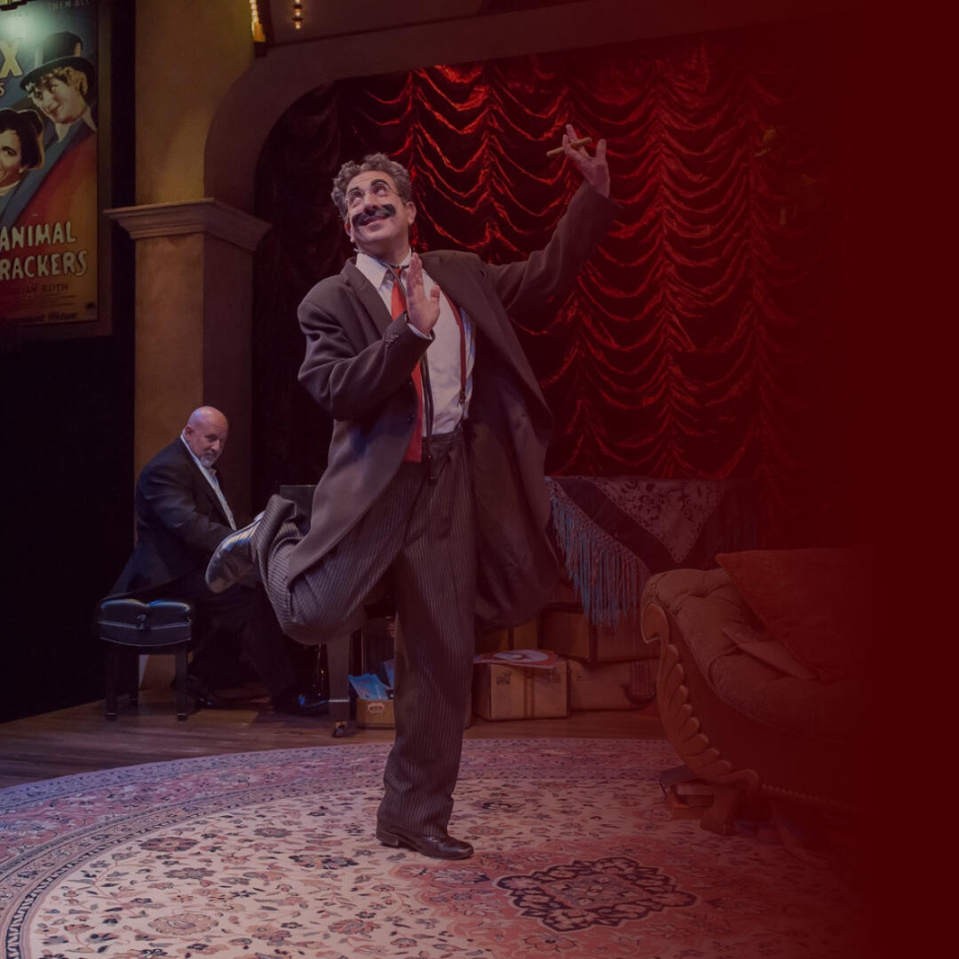 Frank Ferrante performing as Groucho Marx on stage